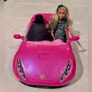 Barbie doll with a car